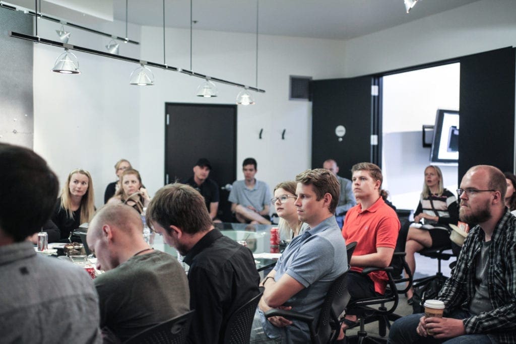 RKS team in group discussion during qualitative user research session in a design studio.