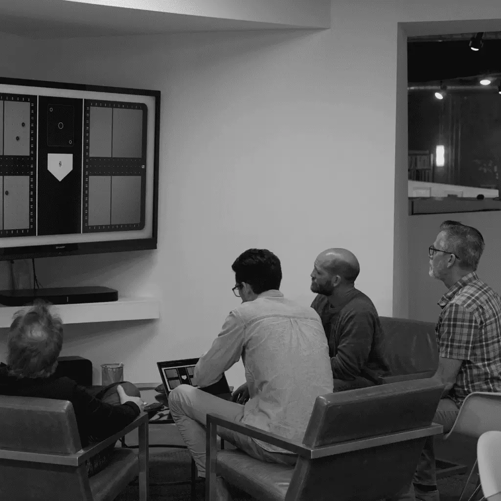RKS team in a strategy meeting reviewing product development progress