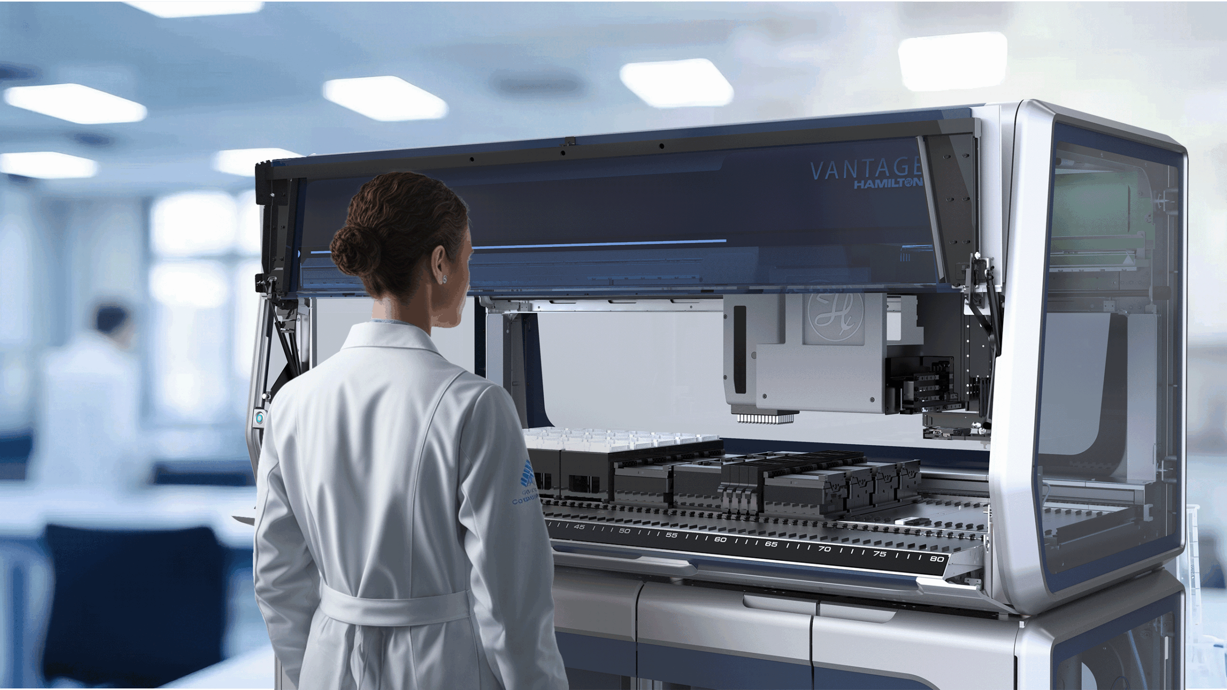 A lab technician using the Hamilton Vantage automated liquid handling system.