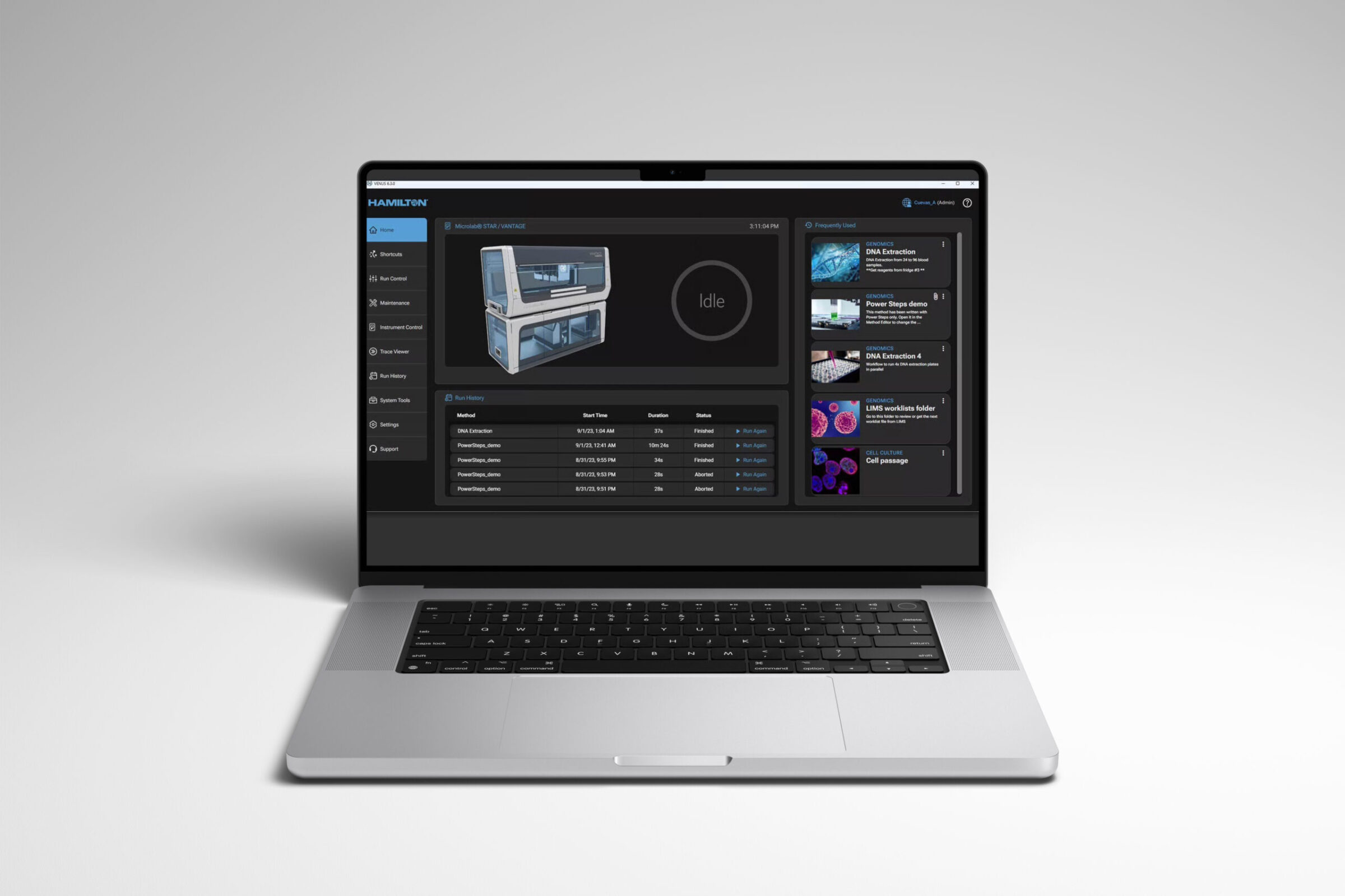 A laptop displaying a dark-themed Hamilton Venus Software dashboard with a laboratory