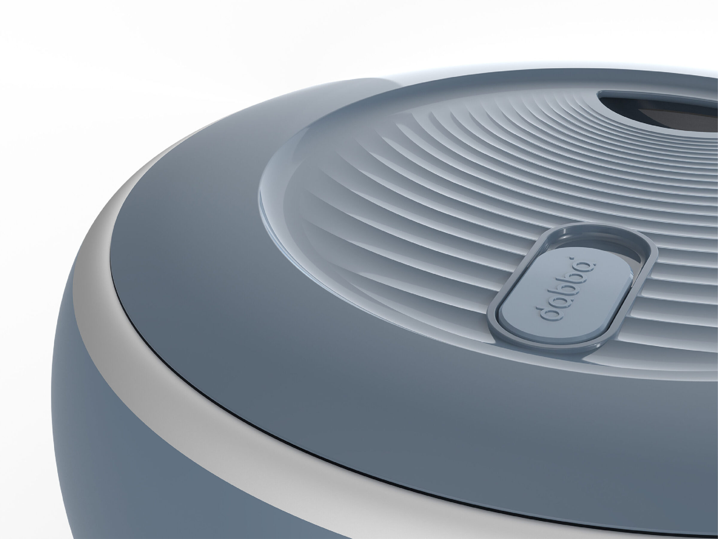Close-up of a sleek, modern, circular device with a ribbed surface and a small,…