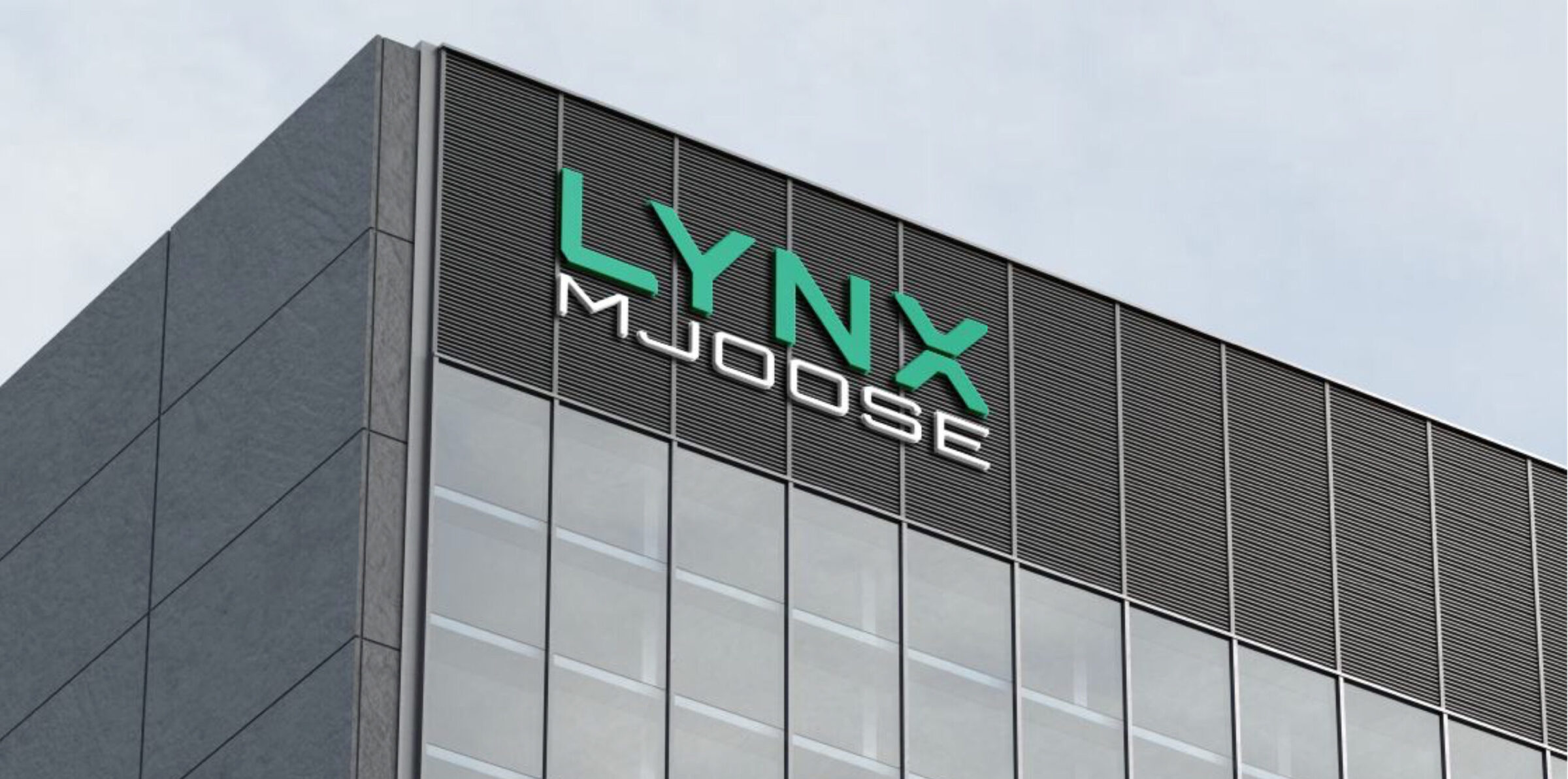 The corner of a modern office building displaying an exterior LYNX company sign.