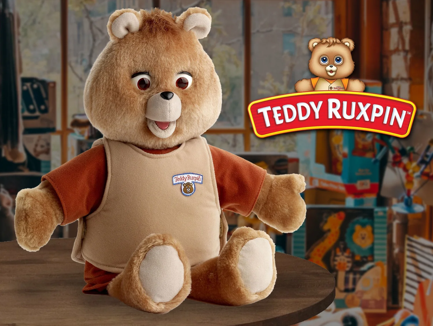 A plush Teddy Ruxpin talking teddy bear sits on a table, wearing a tan vest and orange shirt.