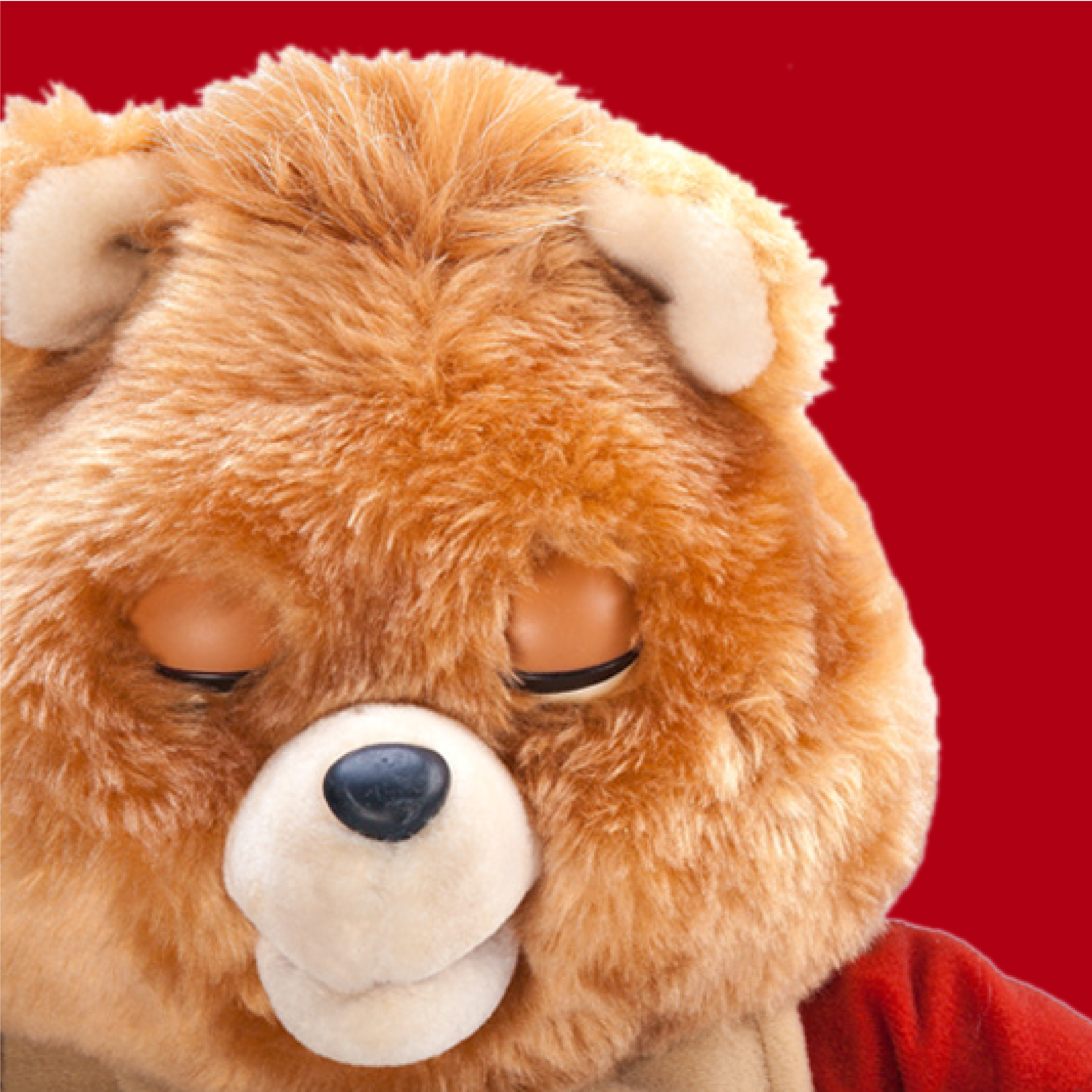 Close-up of a Teddy Ruxpin bear's face with its eyes closed, against a red background
