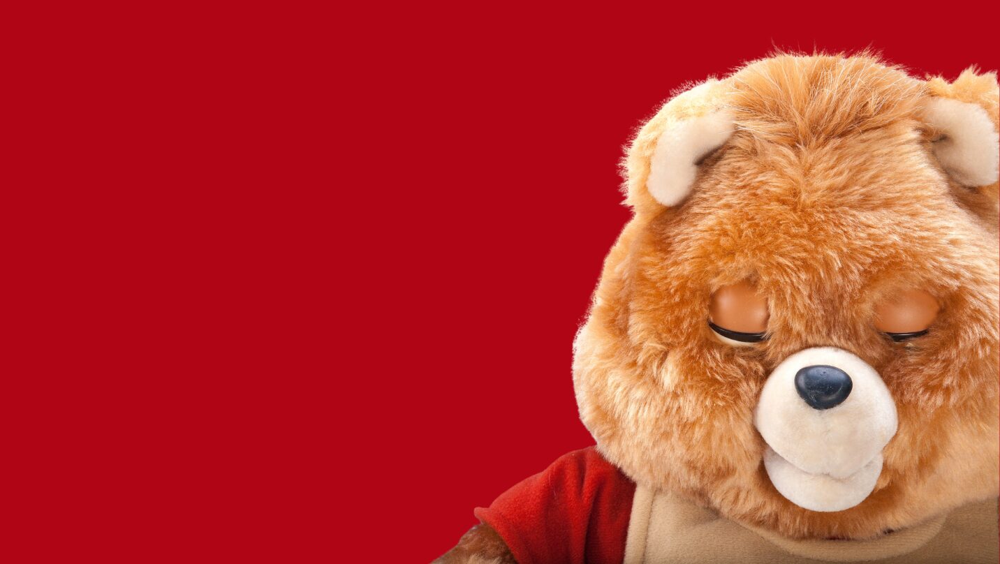 Teddy Ruxpin animatronic storytelling bear beside its RKS Design branding.