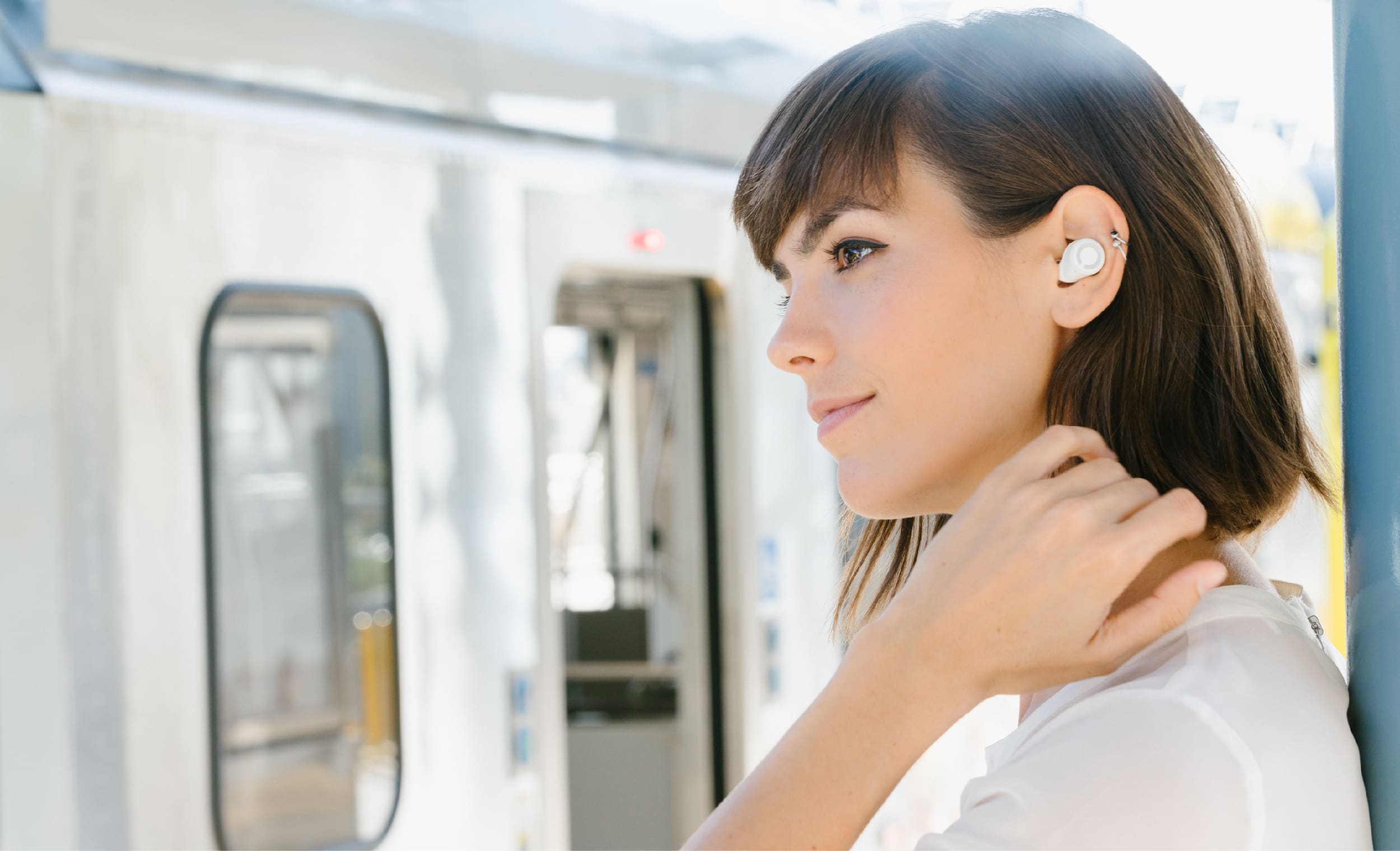 women wearing cue wireless headphones
