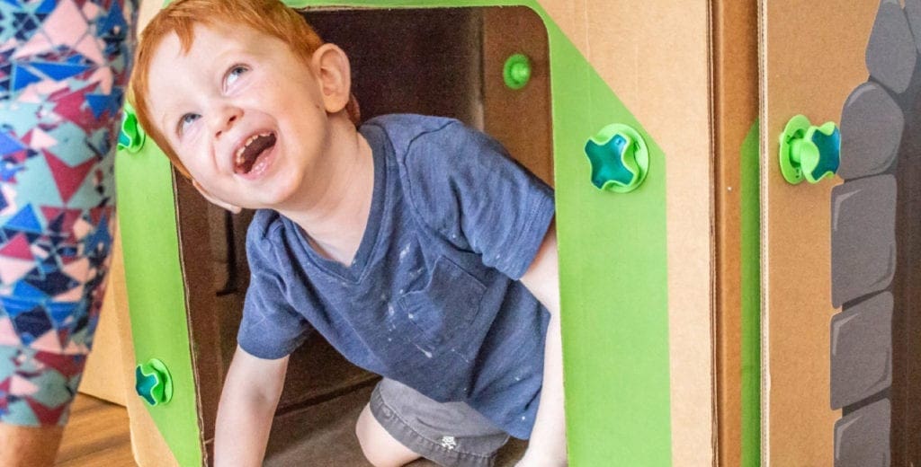 Child playing in a Big Box Play