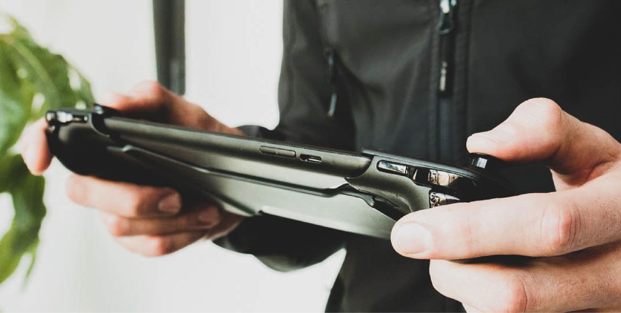 Person holding gamevice gaming device designed by RKS Design
