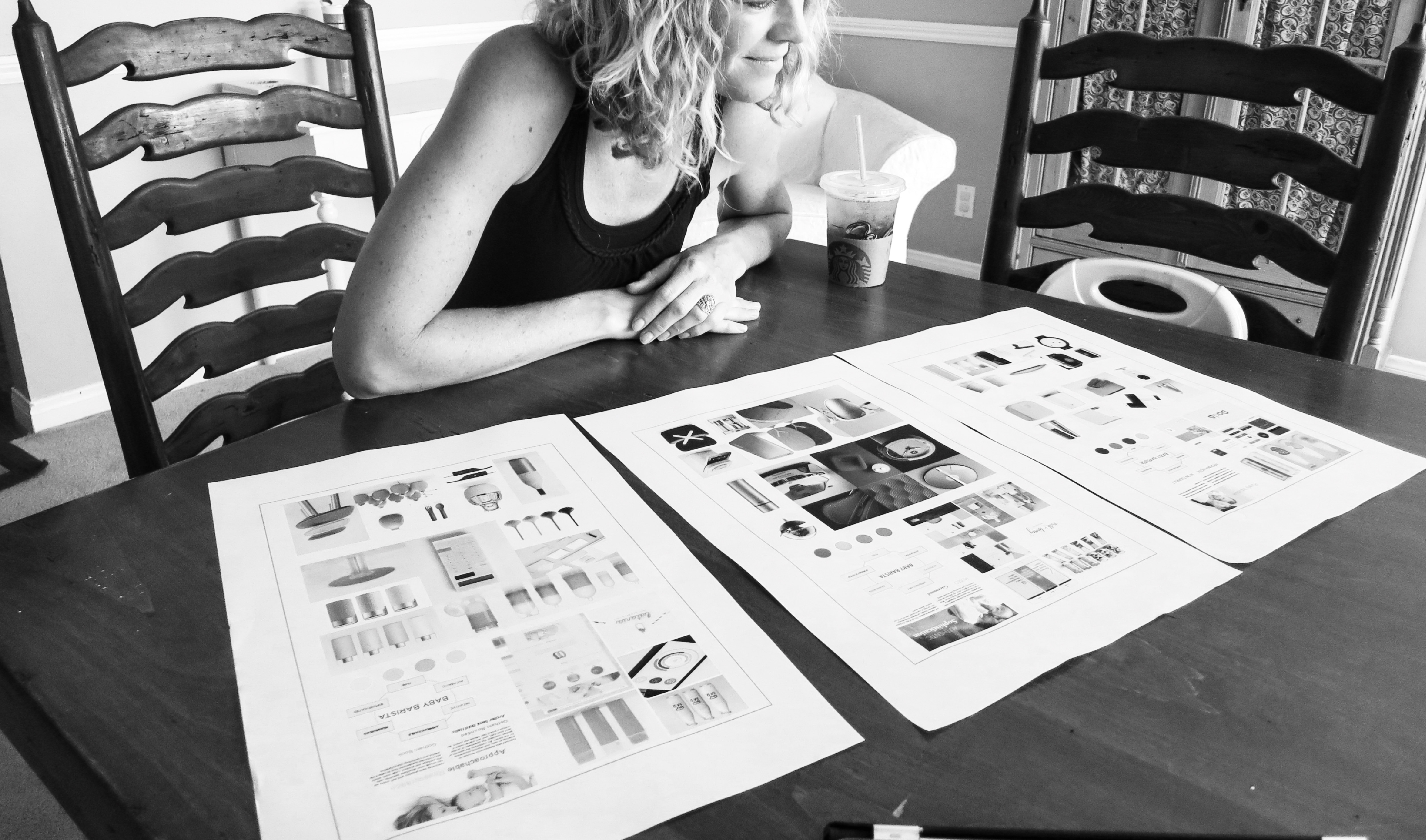 View of RKS Consumer and Market Research women looking at table filled with different images