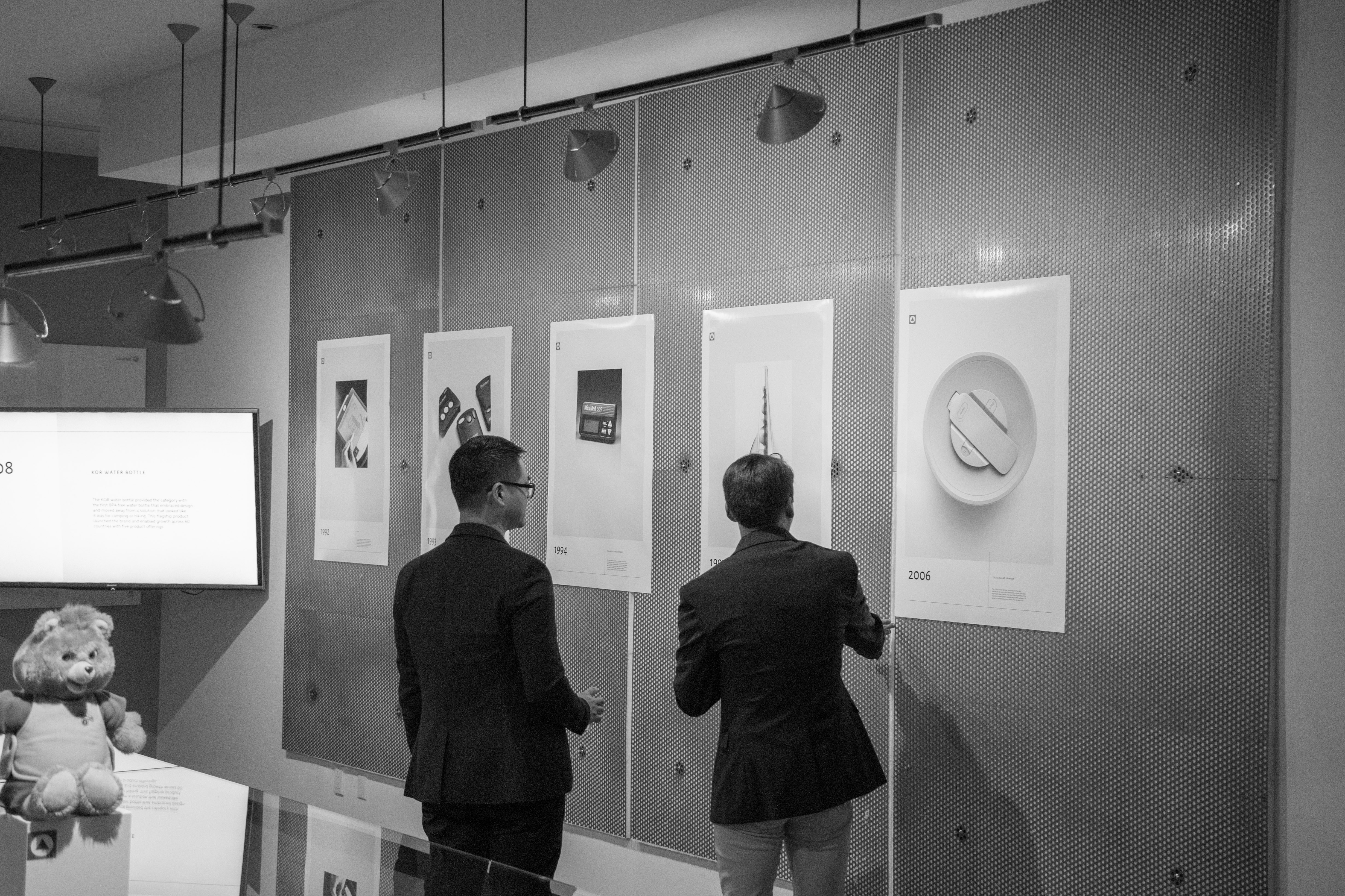 RKS Product Design and Development company employees looking at posters in conference room