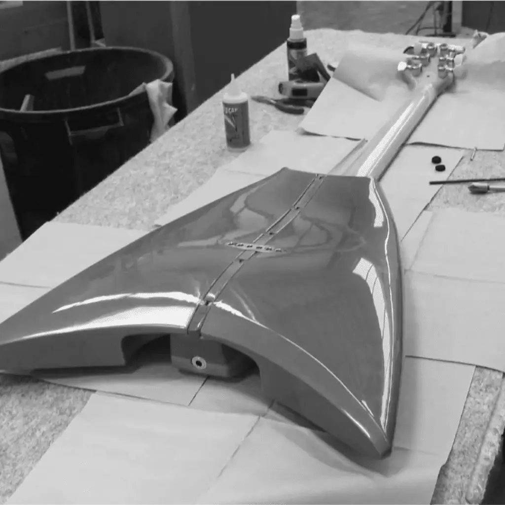 Woman stringing RKS Guitar Product design