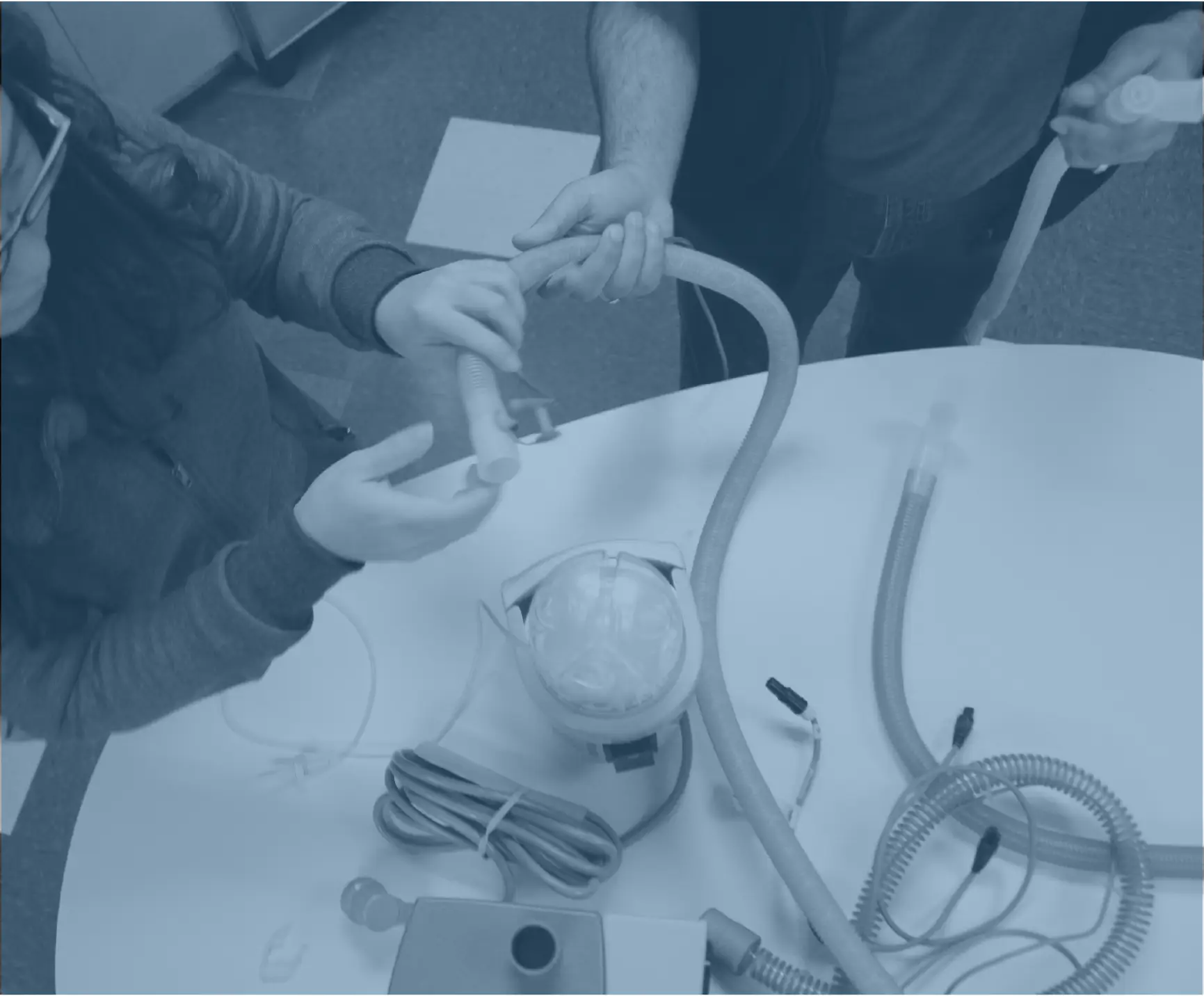 Two Designers at RKS Design putting together a prototype for the Hamilton C6 Ventilator
