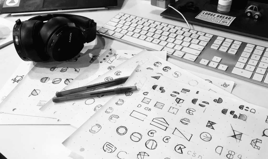 Laid out papers with iterations of logos for the Child Safety Network