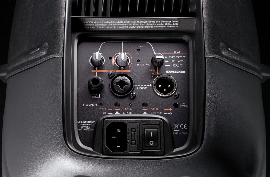 Detailed view of the JBL EON 500 series speaker control panel, showcasing various input and output knobs and switches.