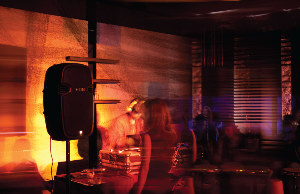JBL EON 500 series speaker in use at a live DJ event, demonstrating its capability in a dynamic sound environment.