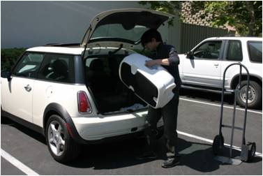 Team testing the portability of a JBL EON speaker prototype, carrying it through different scenarios.