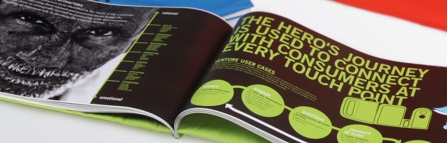 Open book spread showcasing RKS Design’s Hero’s Journey framework, used to enhance consumer engagement for Unilever Laundry Additive.