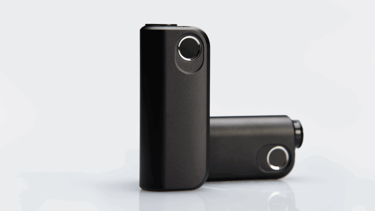 Sleek black connected medical device standing upright with metallic accents and compact form