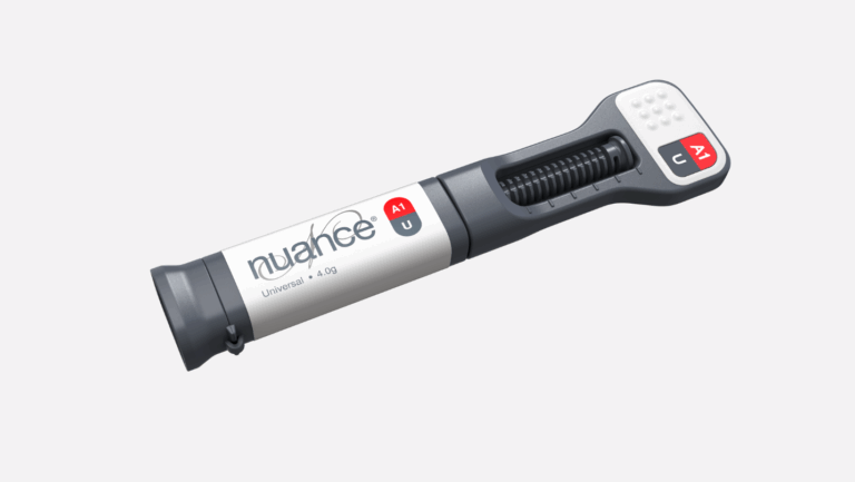 Ergonomic dental syringe with gray and white body, red and black label, and visible spring-loaded mechanism