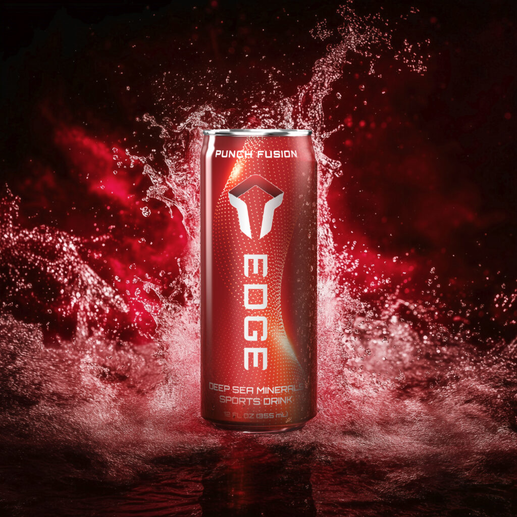 A red can of EDGE Punch Fusion deep sea mineral sports drink stands upright amid a dramatic splash of water, illuminated by vibrant red lighting.