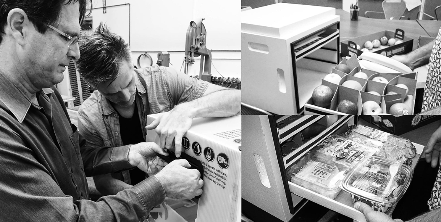 Two men assemble a device on the left; on the right, two images show hands opening drawers revealing organized apples and packaged food inside a storage unit. Black and white photo.