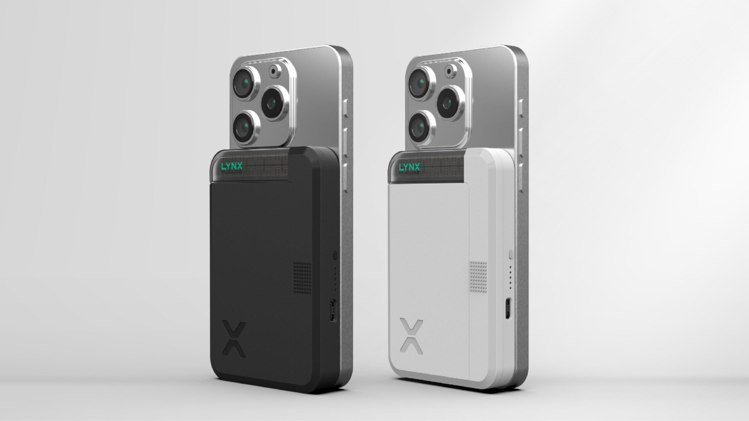 Two smartphones, one black and one white, attached to matching external camera modules with triple lens systems, are displayed standing upright against a plain light background.